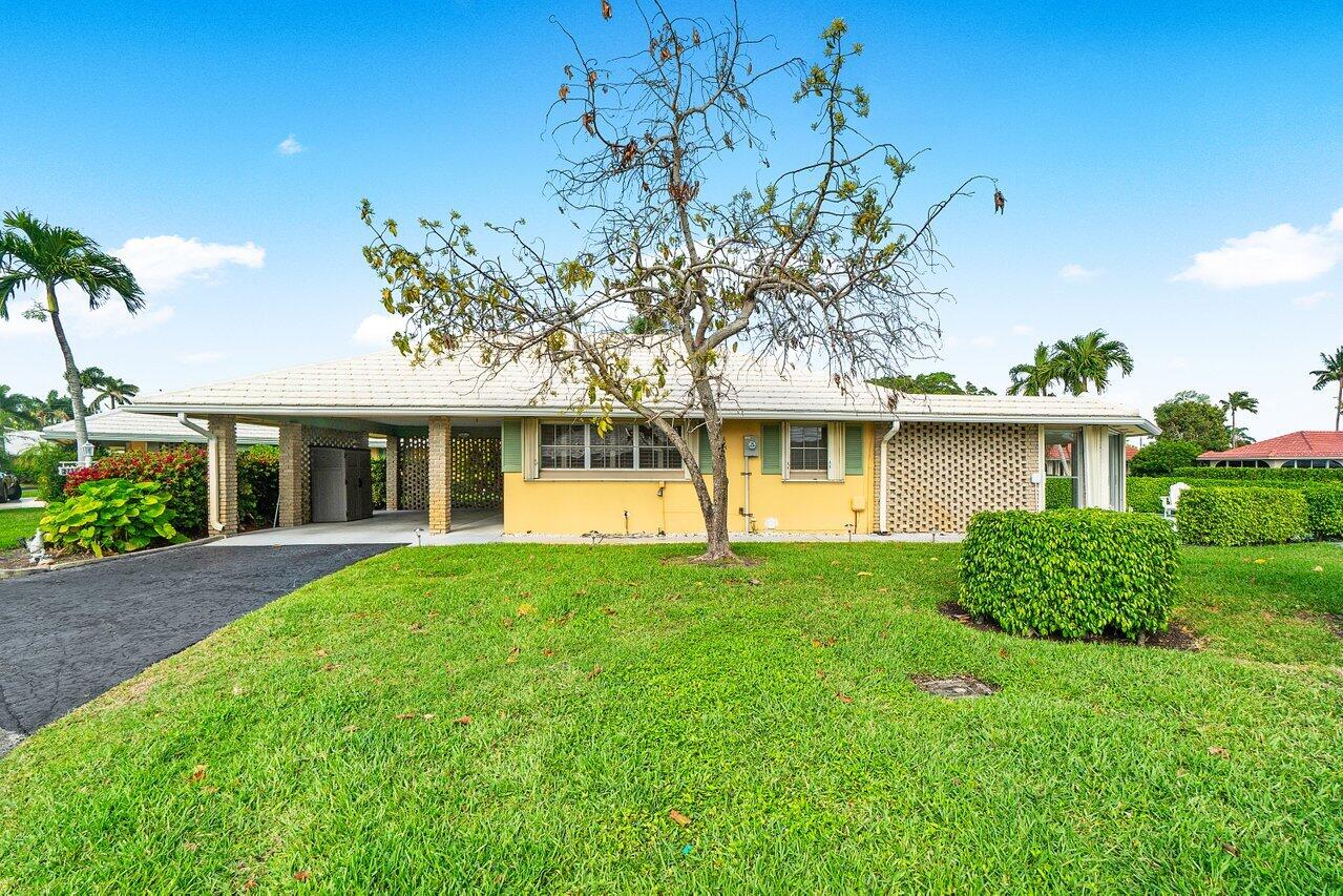 362 Yorktowne Circle Atlantis, FL 33462 - Photo 2 of 41 front view of a house with a yard