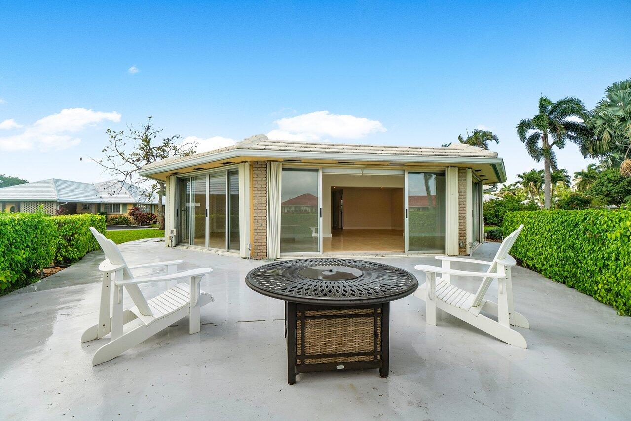 362 Yorktowne Circle Atlantis, FL 33462 - Photo 25 of 41 a view of a chair and table in a patio