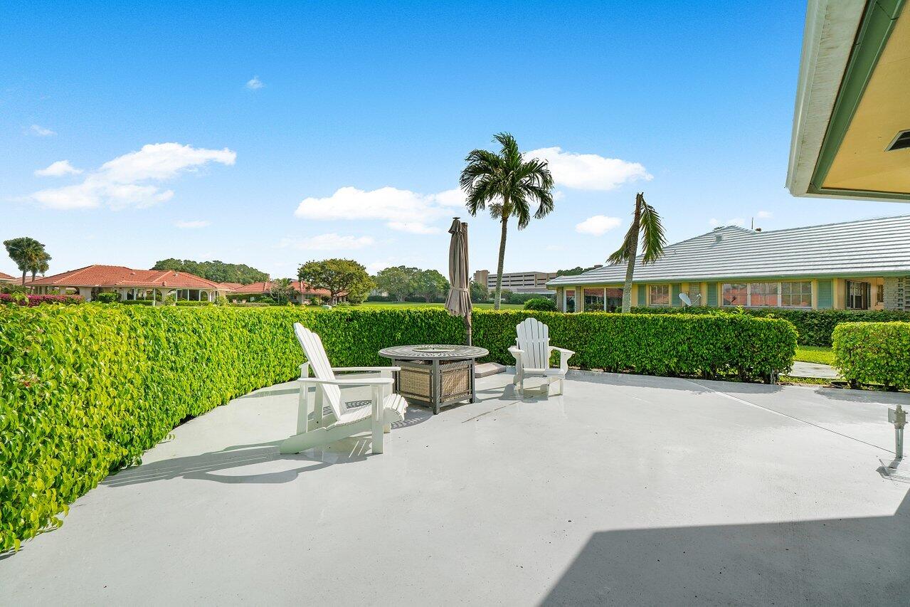 362 Yorktowne Circle Atlantis, FL 33462 - Photo 26 of 41 a view of a patio with a table and chairs