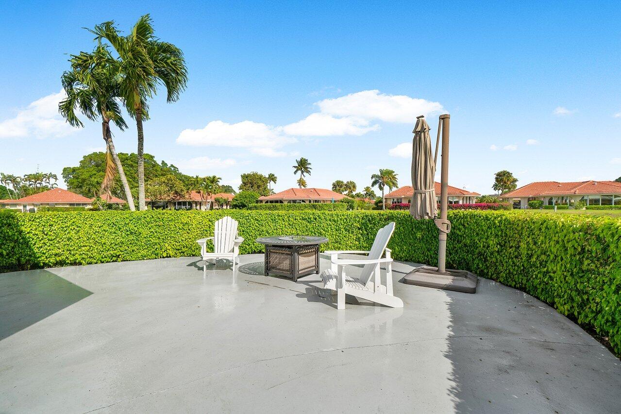 362 Yorktowne Circle Atlantis, FL 33462 - Photo 27 of 41 a view of a patio with a table and chairs