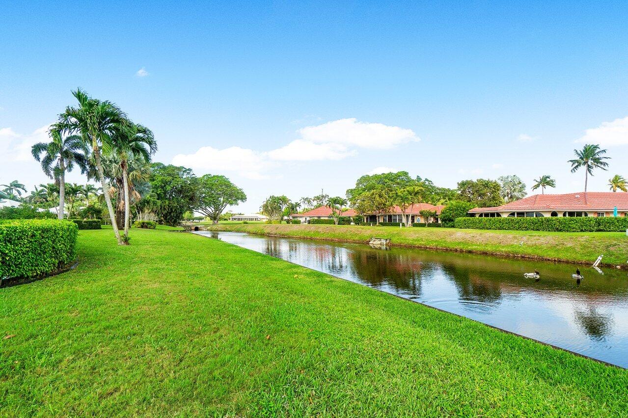 362 Yorktowne Circle Atlantis, FL 33462 - Photo 28 of 41 a view of a lake with houses in the back