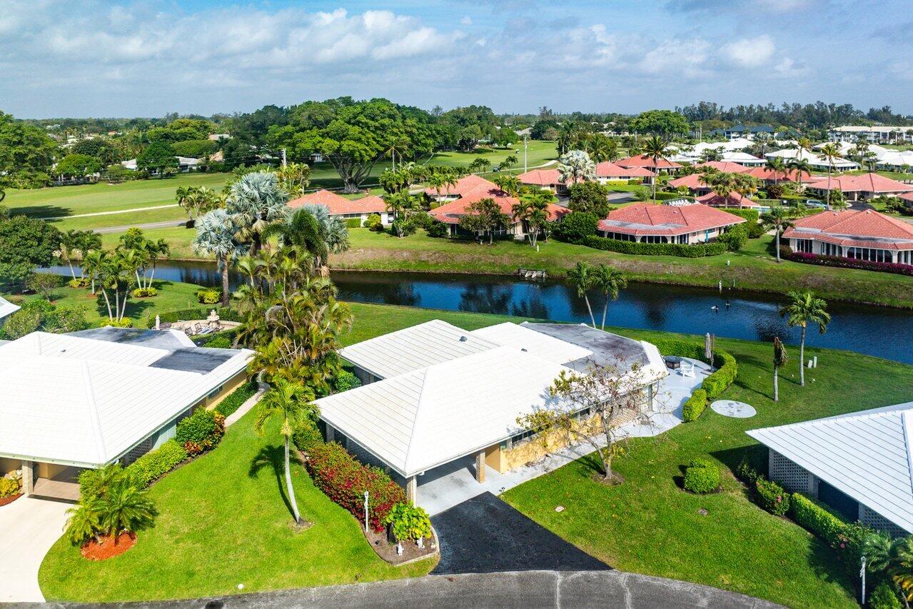 362 Yorktowne Circle Atlantis, FL 33462 - Photo 31 of 41 a view of a lake with a house