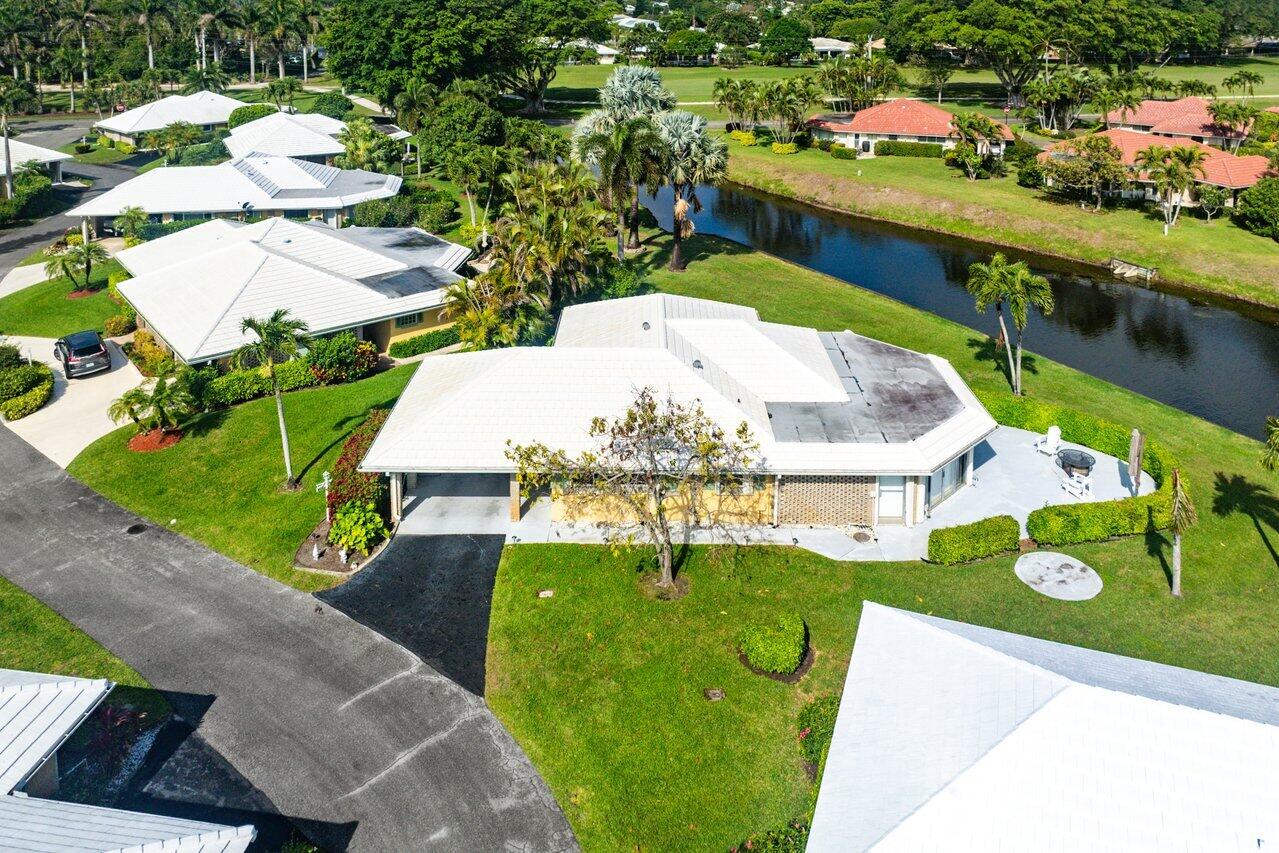 362 Yorktowne Circle Atlantis, FL 33462 - Photo 32 of 41 a view of a swimming pool with a yard