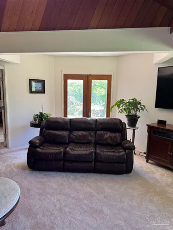 a living room with furniture and a table