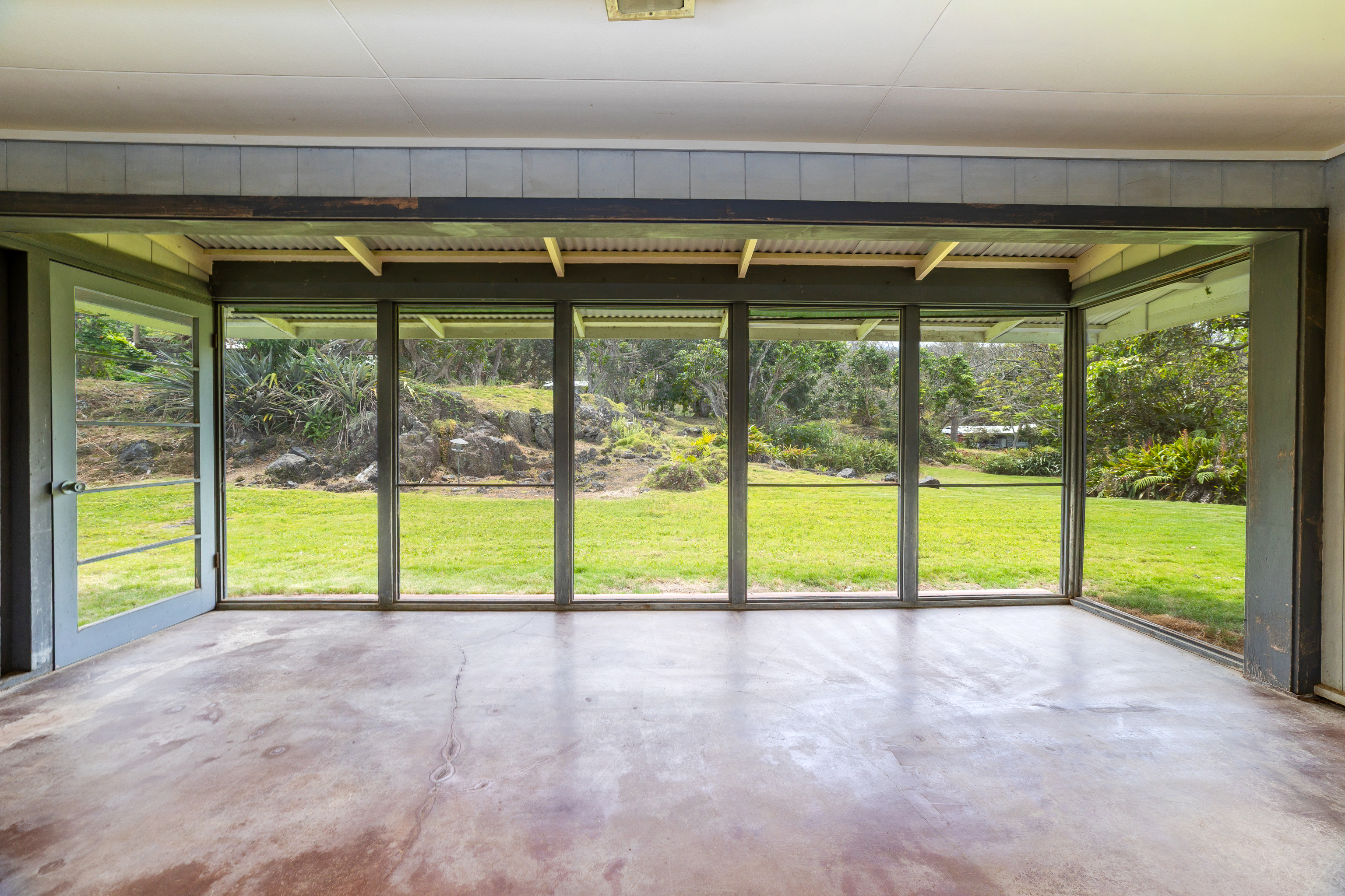 86-4190 Hookena Beach Road Captain Cook, HI 96704 - Photo 9 of 30 a view of an empty room with window