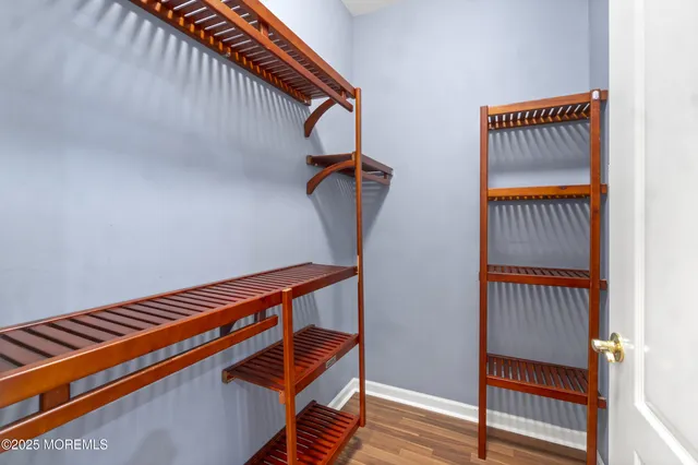 a view of staircase with wooden floor