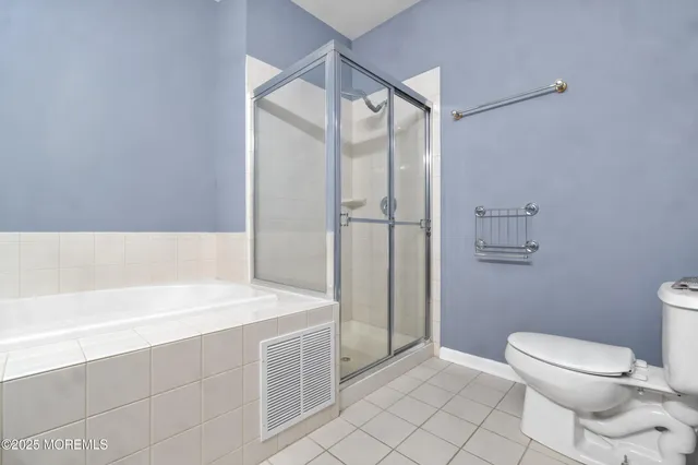 a bathroom with a toilet and a bathtub