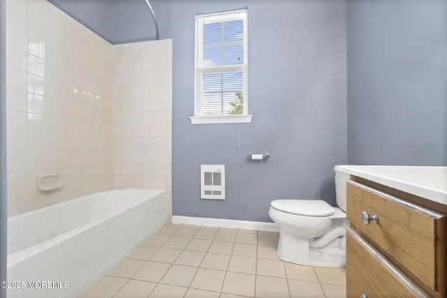 a bathroom with a toilet a sink and a bathtub