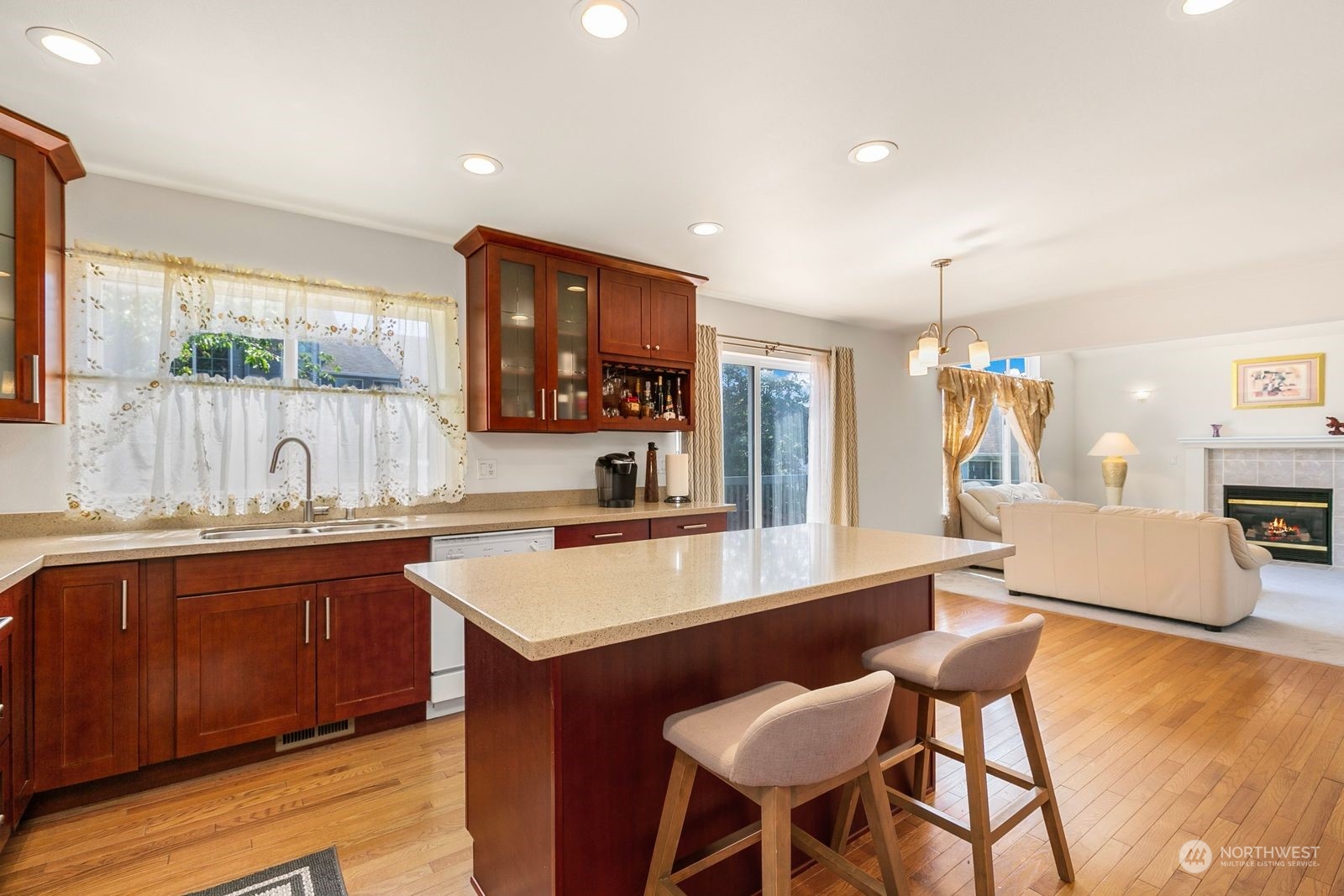 1123 South 34th Street Renton, WA 98055 - Photo 10 of 25 a large kitchen with stainless steel appliances a large counter top space and a sink