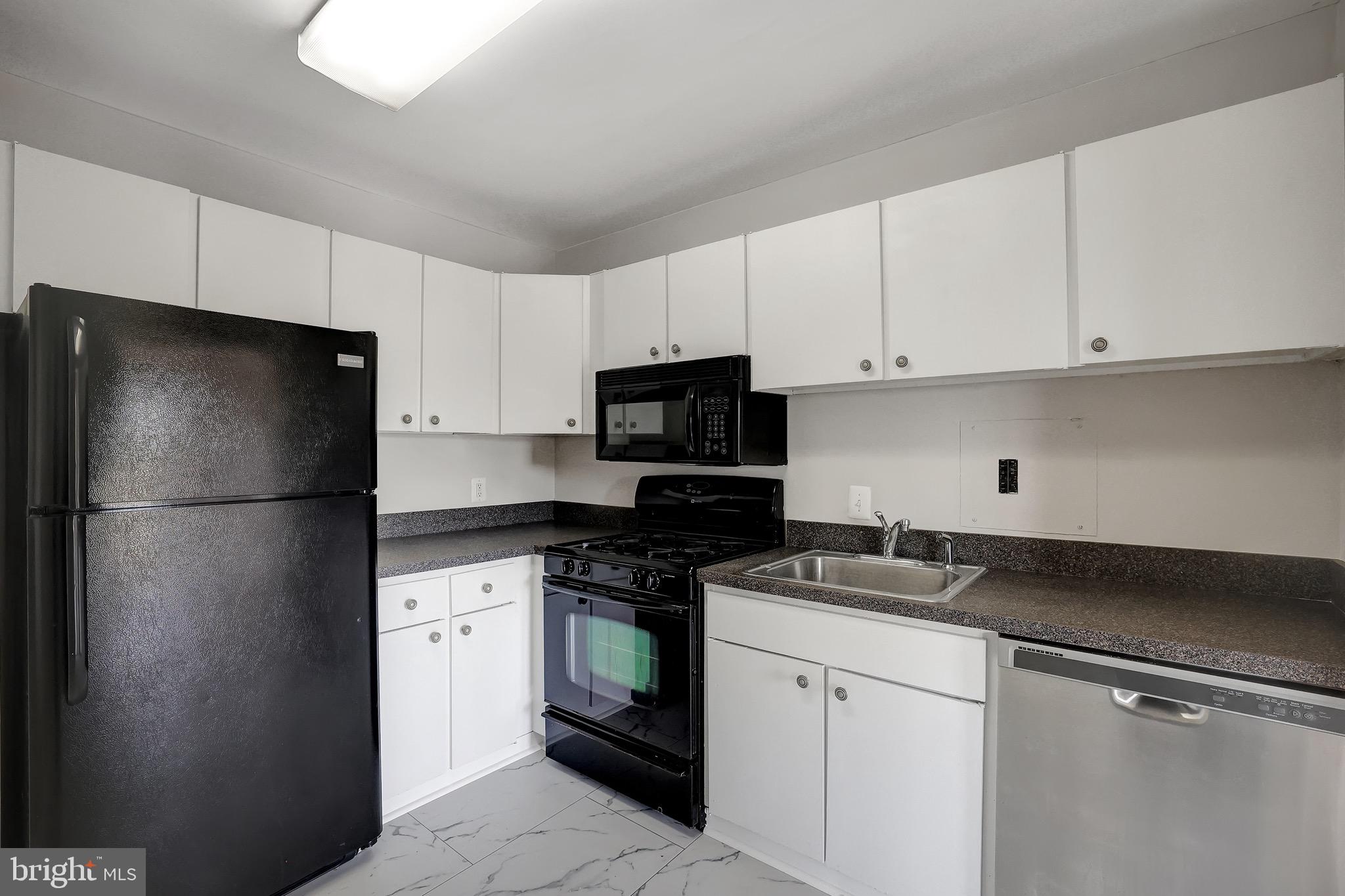 1111 University Boulevard West, Unit 703A Silver Spring, MD 20902 - Photo 4 of 33 Kitchen w/ BRAND NEW Flooring.
