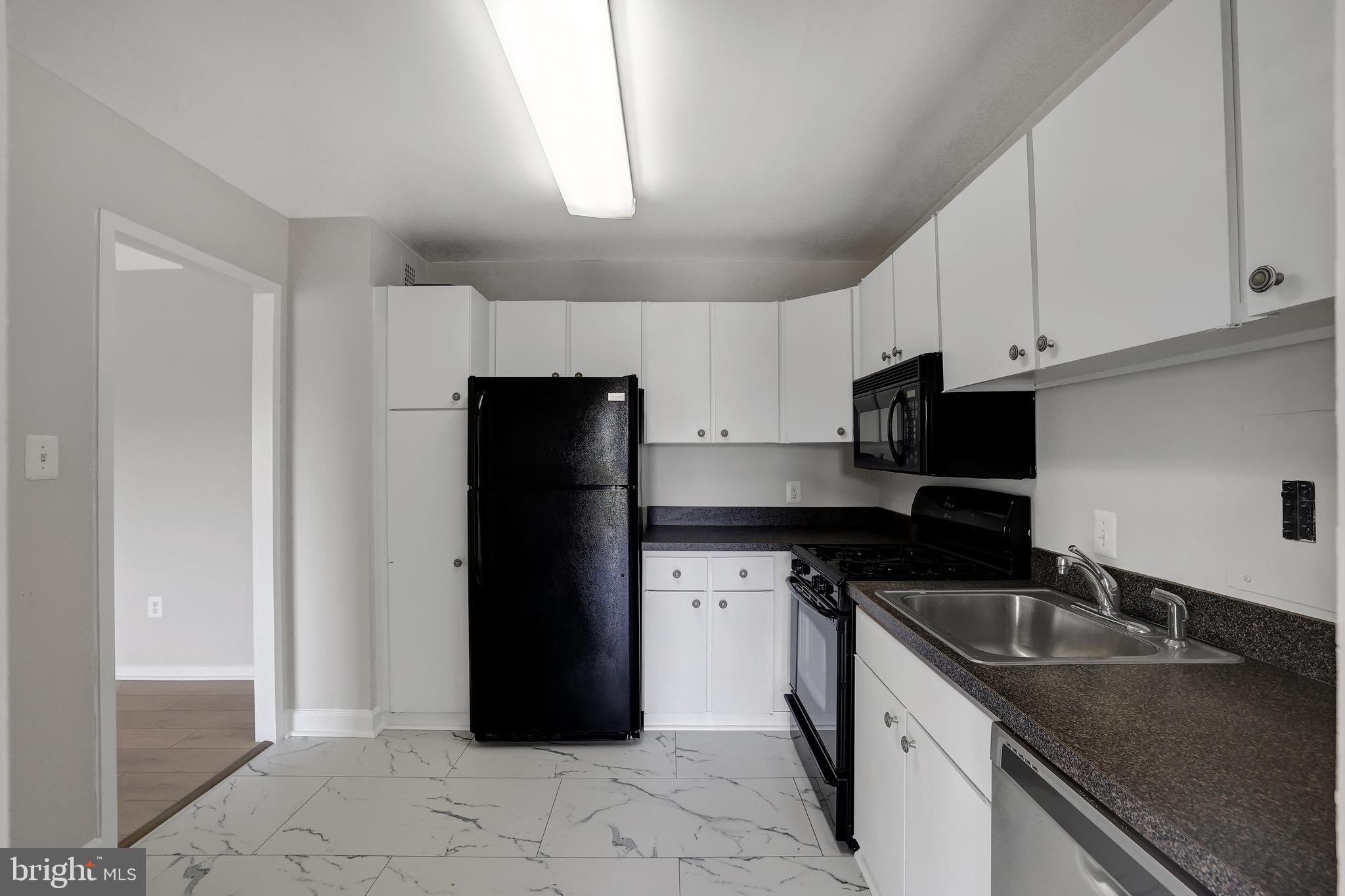 1111 University Boulevard West, Unit 703A Silver Spring, MD 20902 - Photo 5 of 33 Kitchen w/ BRAND NEW Flooring.