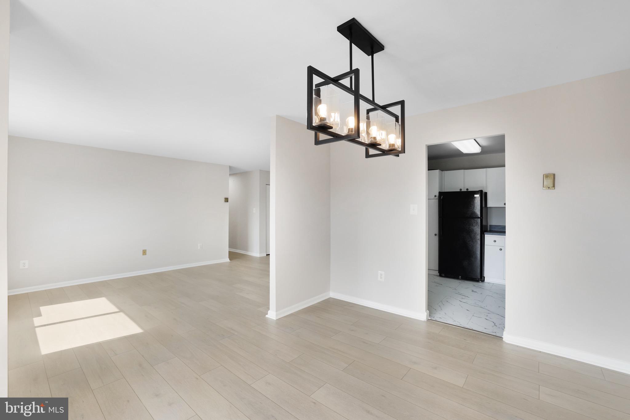 1111 University Boulevard West, Unit 703A Silver Spring, MD 20902 - Photo 6 of 33 Dining Room w/ Brand NEW LVP.