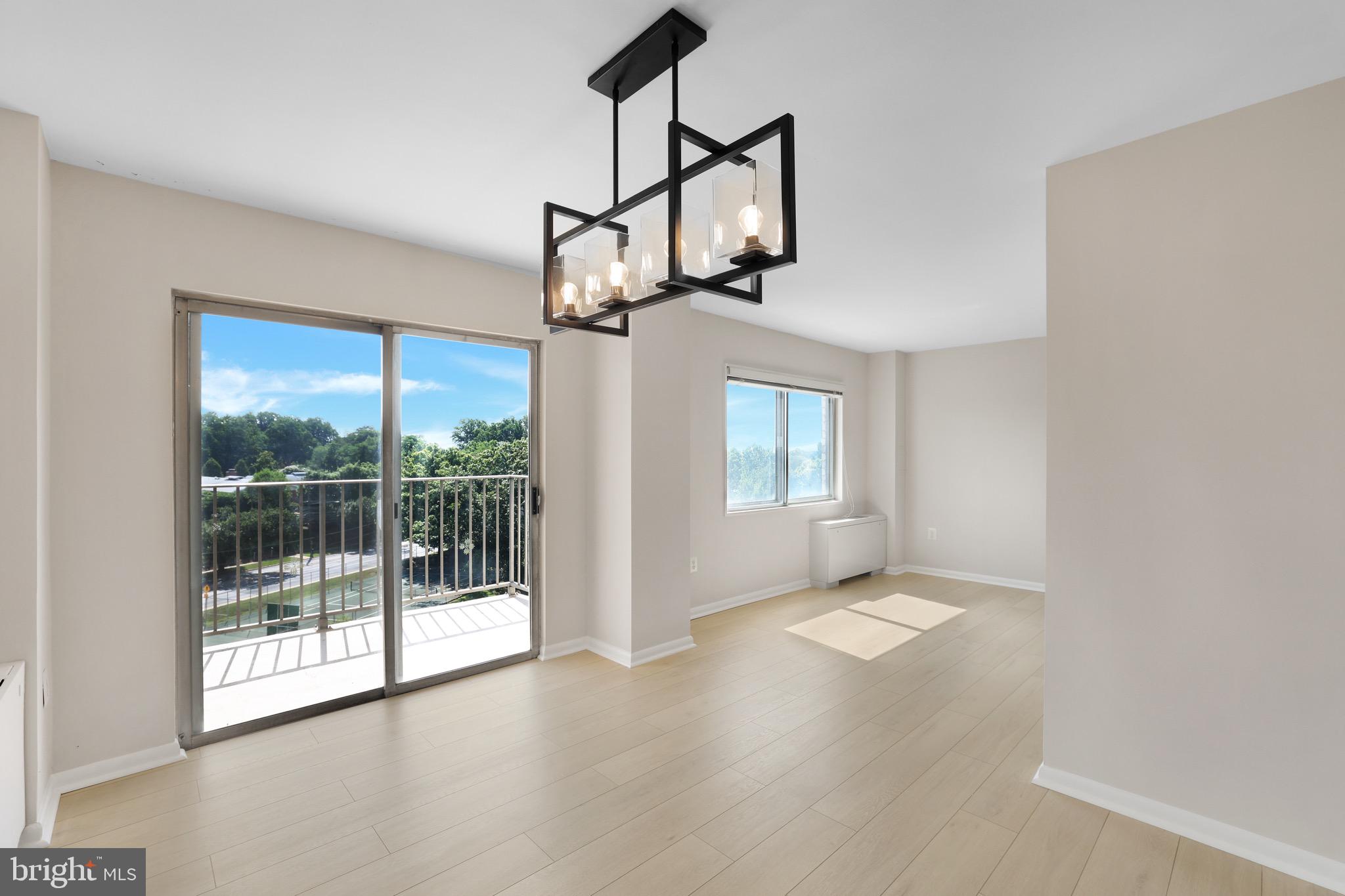1111 University Boulevard West, Unit 703A Silver Spring, MD 20902 - Photo 9 of 33 Dining Room | Brand NEW LVP | Balcony Access.