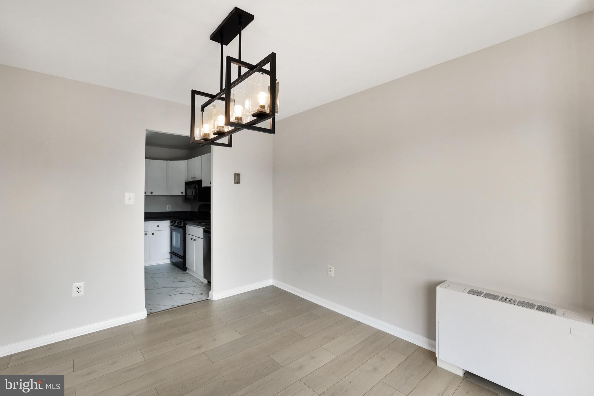 1111 University Boulevard West, Unit 703A Silver Spring, MD 20902 - Photo 10 of 33 Dining Room | Brand NEW LVP | Balcony Access.
