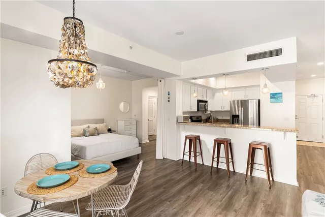 a large kitchen with a table and chairs