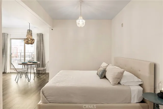 a bedroom with a bed and a table