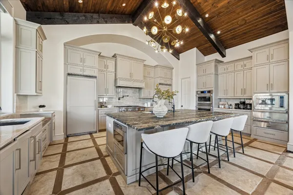 a kitchen with a stove and cabinets