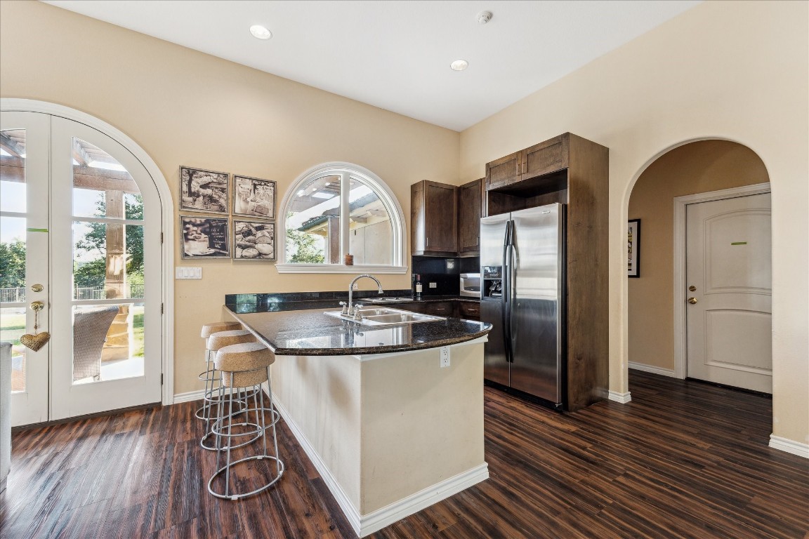 9 Rue Boerne, TX 78006 - Photo 41 of 50 a kitchen with stainless steel appliances granite countertop a sink and a refrigerator
