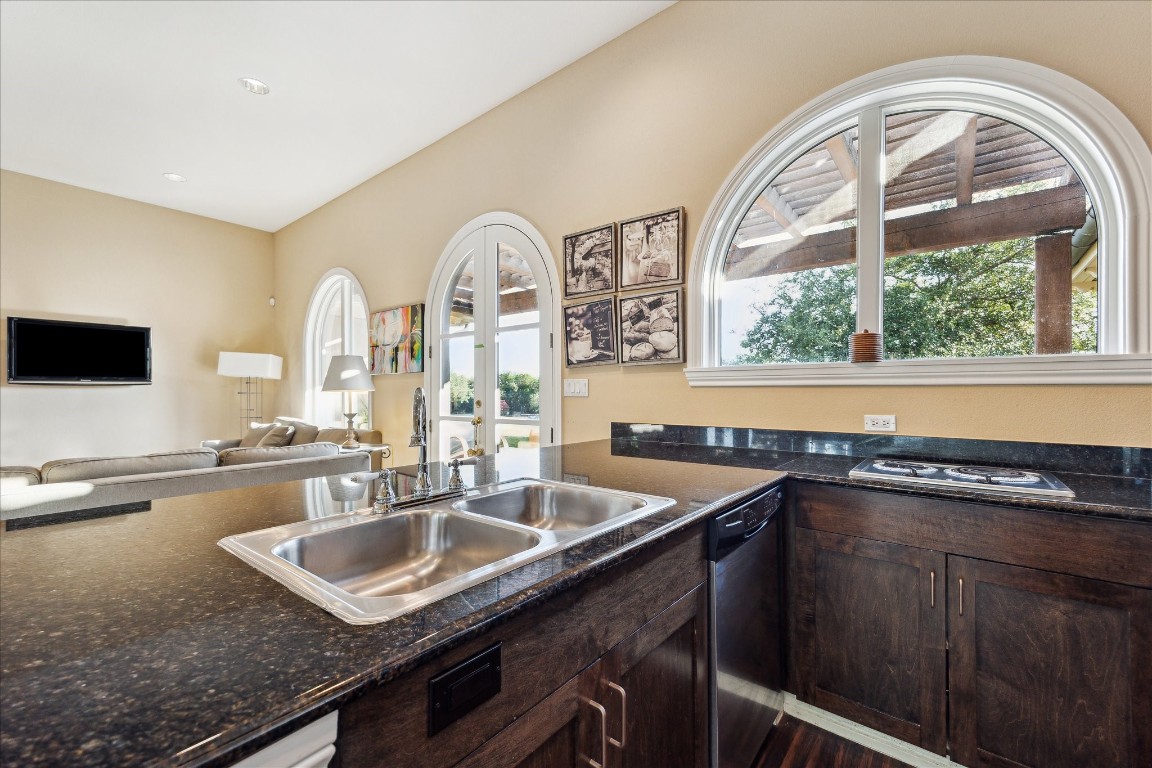 9 Rue Boerne, TX 78006 - Photo 42 of 50 a kitchen with a sink a counter top space and a large window