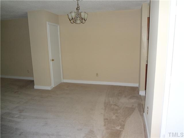 2514 Avent Ferry Road, Unit 103 Raleigh, NC 27606 - Photo 3 of 6 a view of a hallway with a chandelier fan