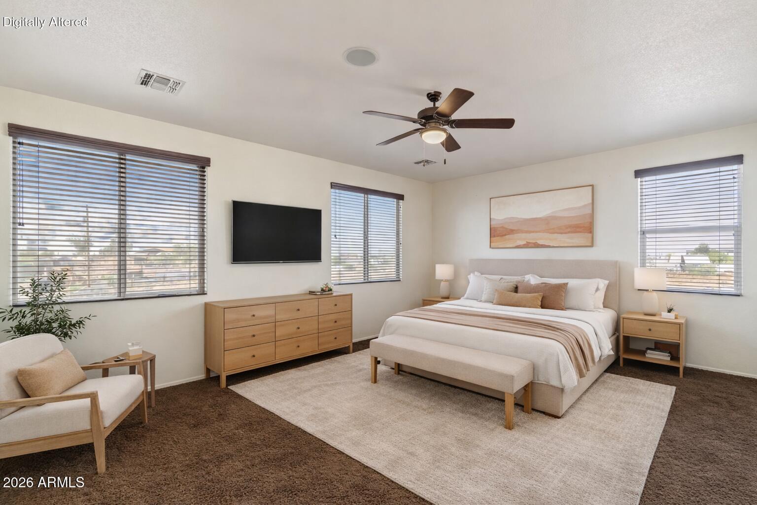 7634 West Apollo Road Laveen, AZ 85339 - Photo 16 of 34 a bedroom with a bed and a flat screen tv