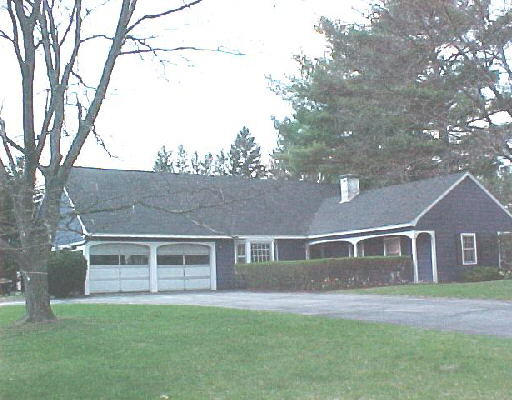 65 Old Hickory Road Lancaster, MA 01523 - Photo 1 of 1 a front view of a house with a garden