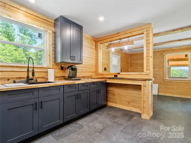 a backyard of a house with barbeque oven