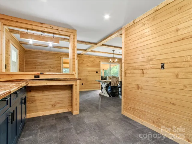 a view of balcony with wooden floor and fence