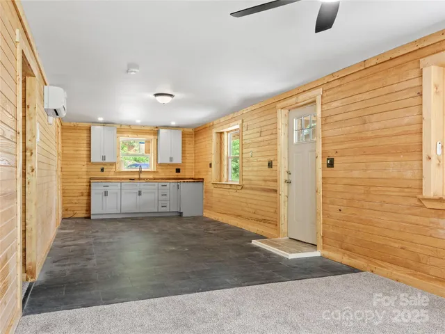 a view of a kitchen with a sink and a window