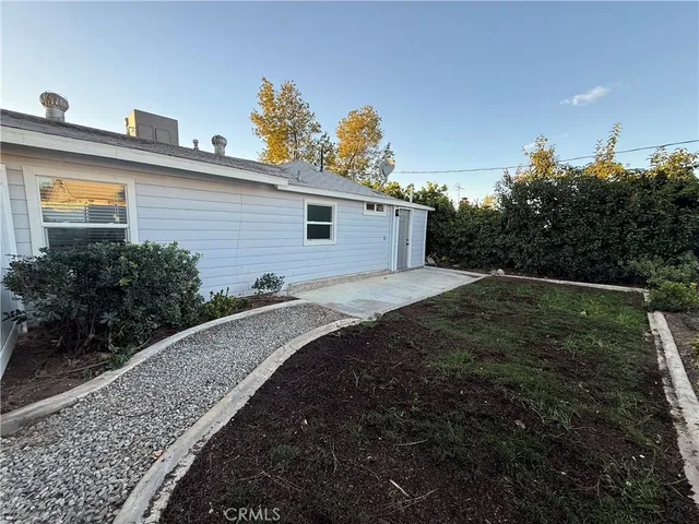 a backyard of a house with lots of green space