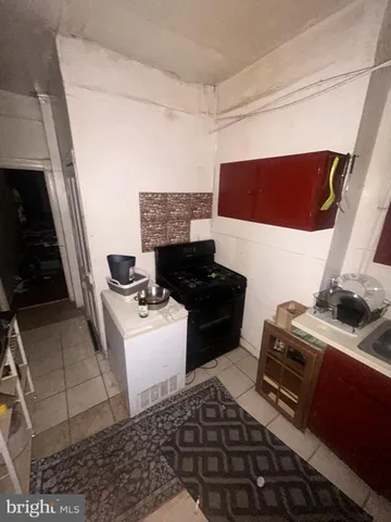 a kitchen with a stove and a refrigerator