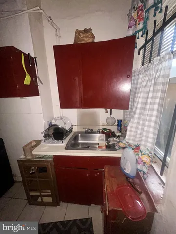 a room with stainless steel appliances kitchen island granite countertop furniture a sink and a stove