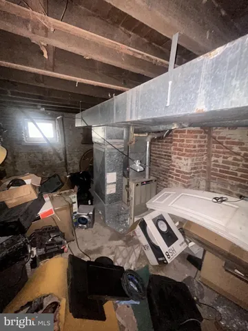 a room with water heater and storage