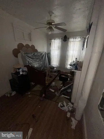 a room with water heater and wooden floor