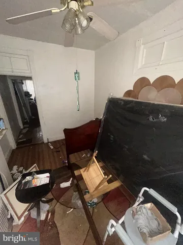 a living room with furniture and a mirror