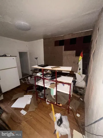 a room with gym equipment and a view of living room