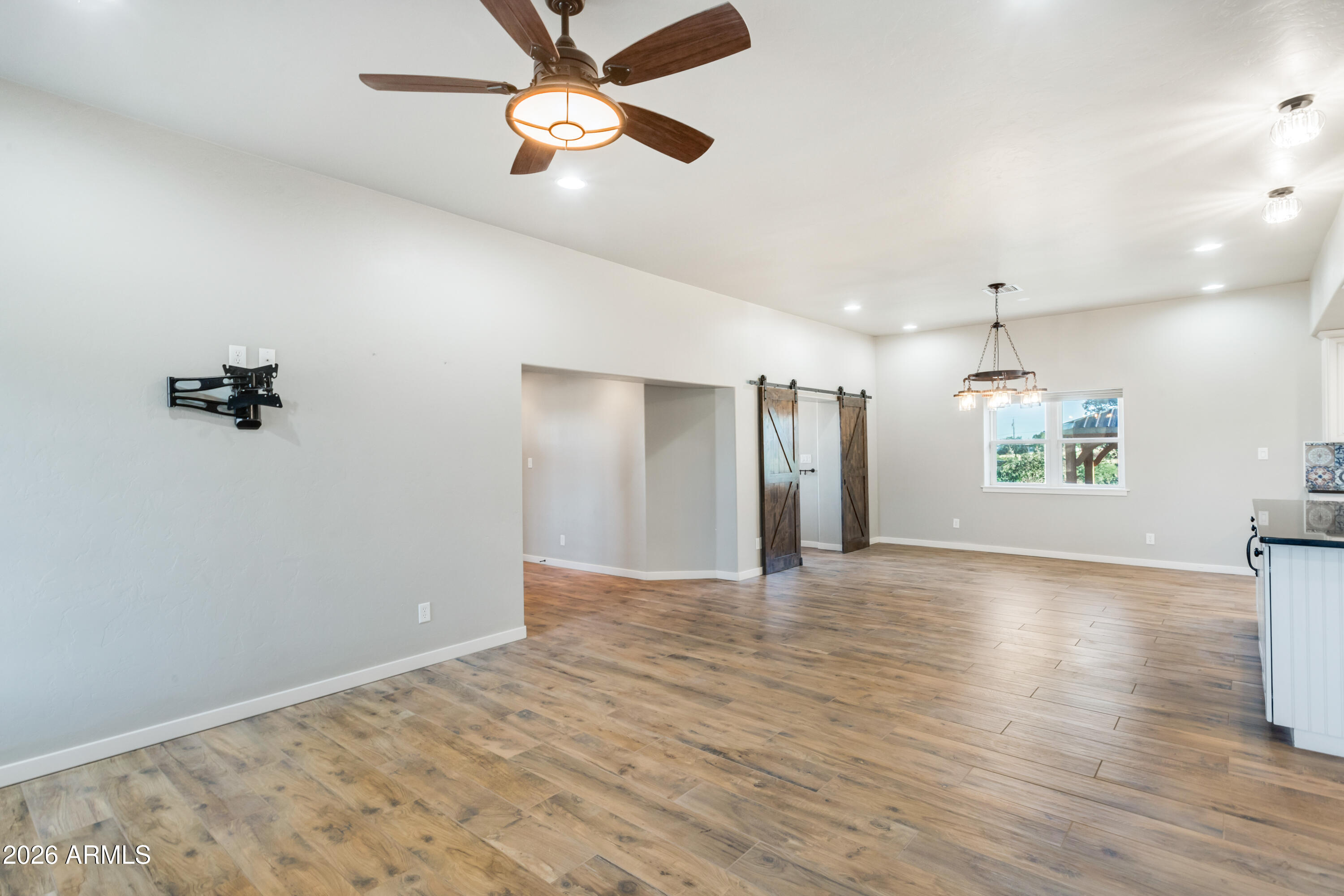 5306 East Spring Road Hereford, AZ 85615 - Photo 11 of 61 a view of an empty room with a window