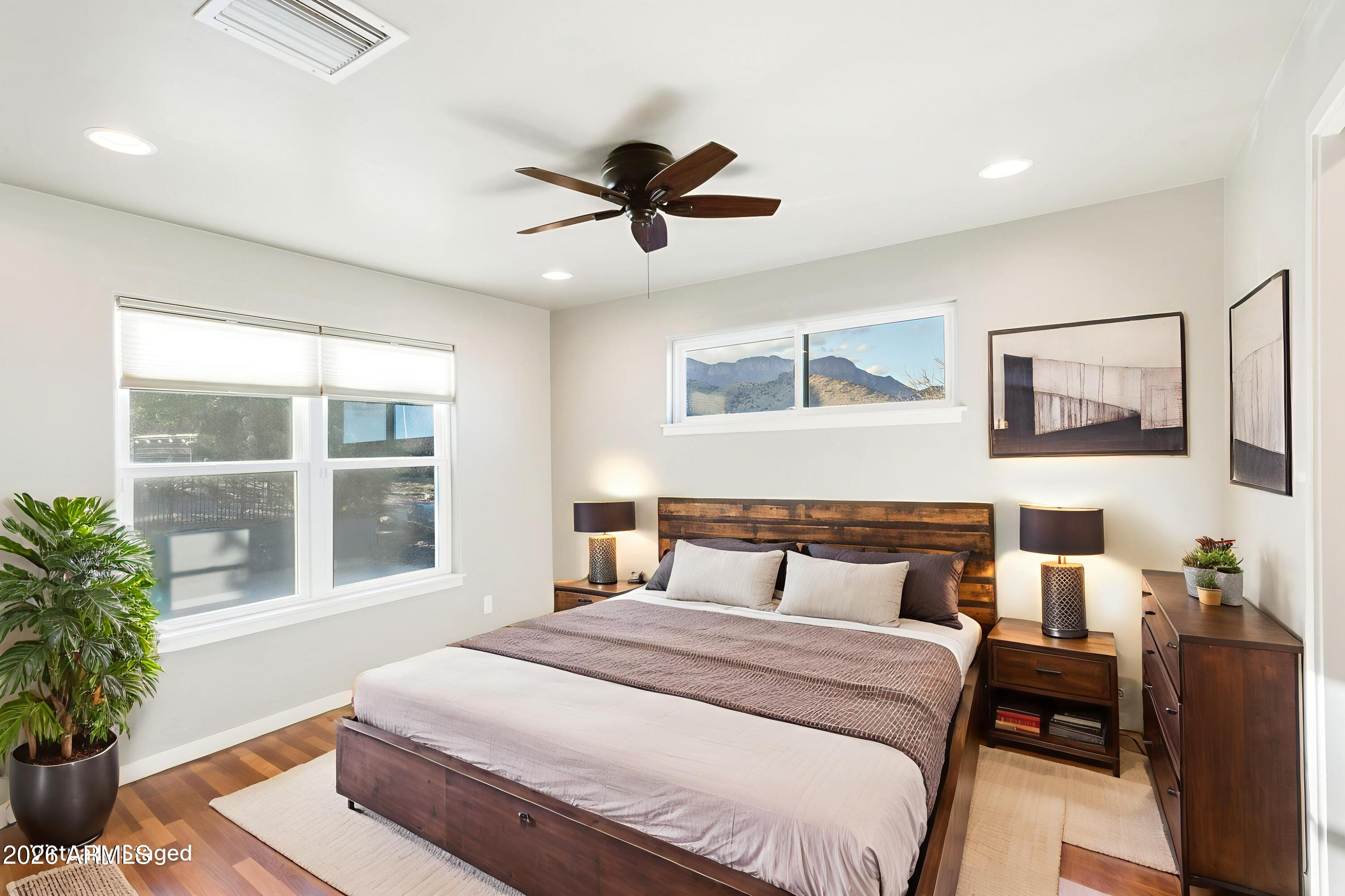 5306 East Spring Road Hereford, AZ 85615 - Photo 25 of 61 a bedroom with a large bed and a window