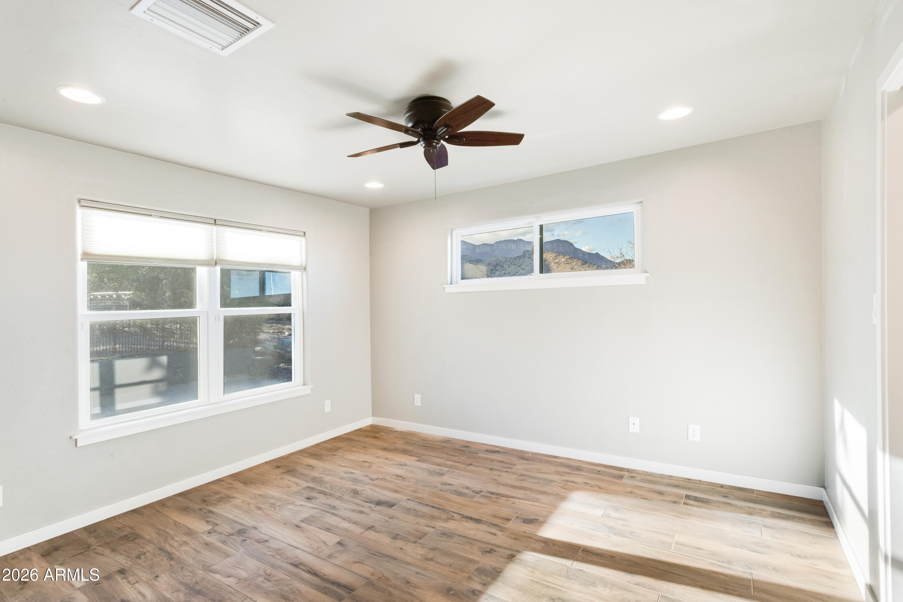 5306 East Spring Road Hereford, AZ 85615 - Photo 26 of 61 a view of an empty room with a window