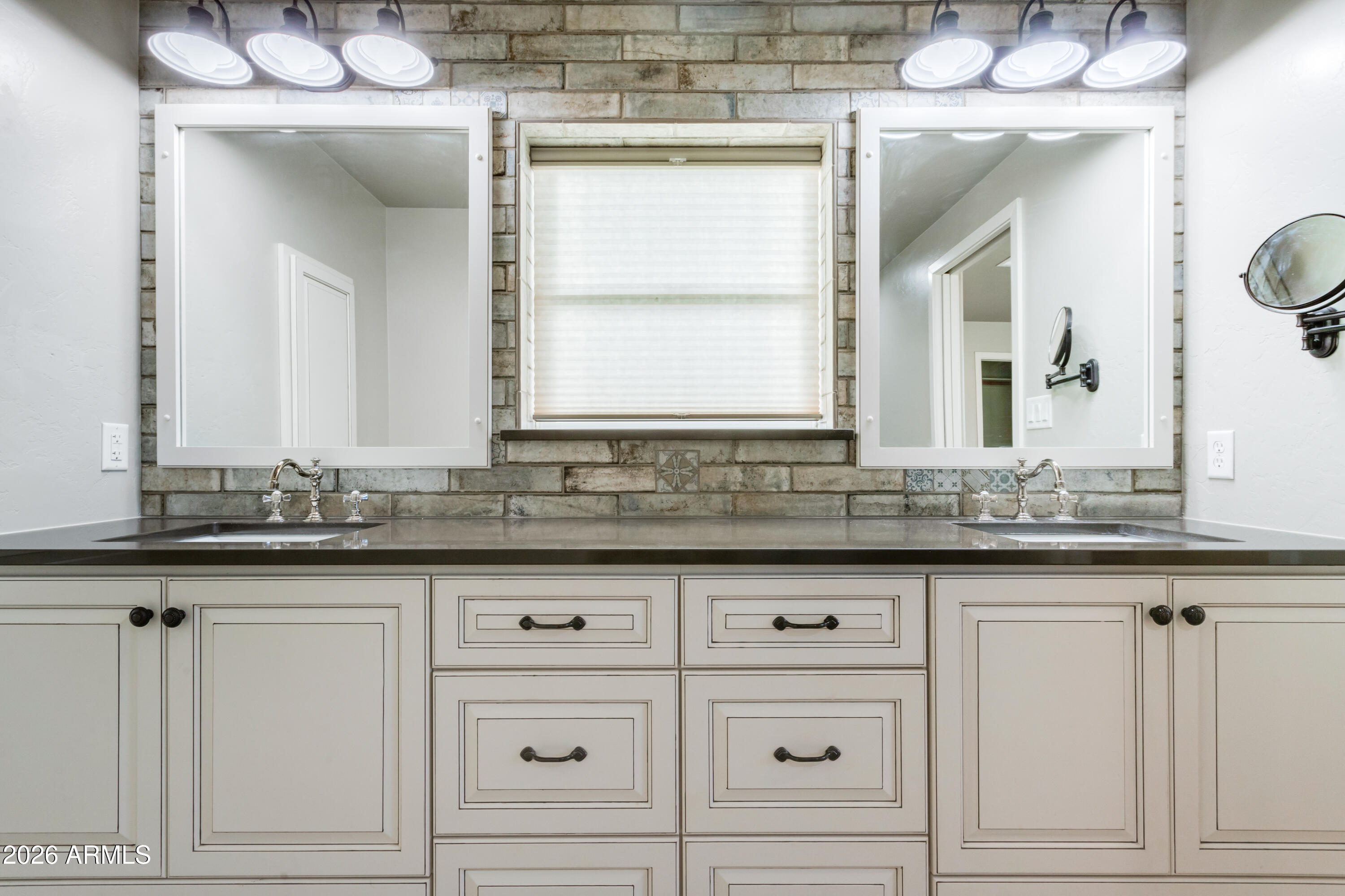 5306 East Spring Road Hereford, AZ 85615 - Photo 30 of 61 a bathroom with a sink and a mirror