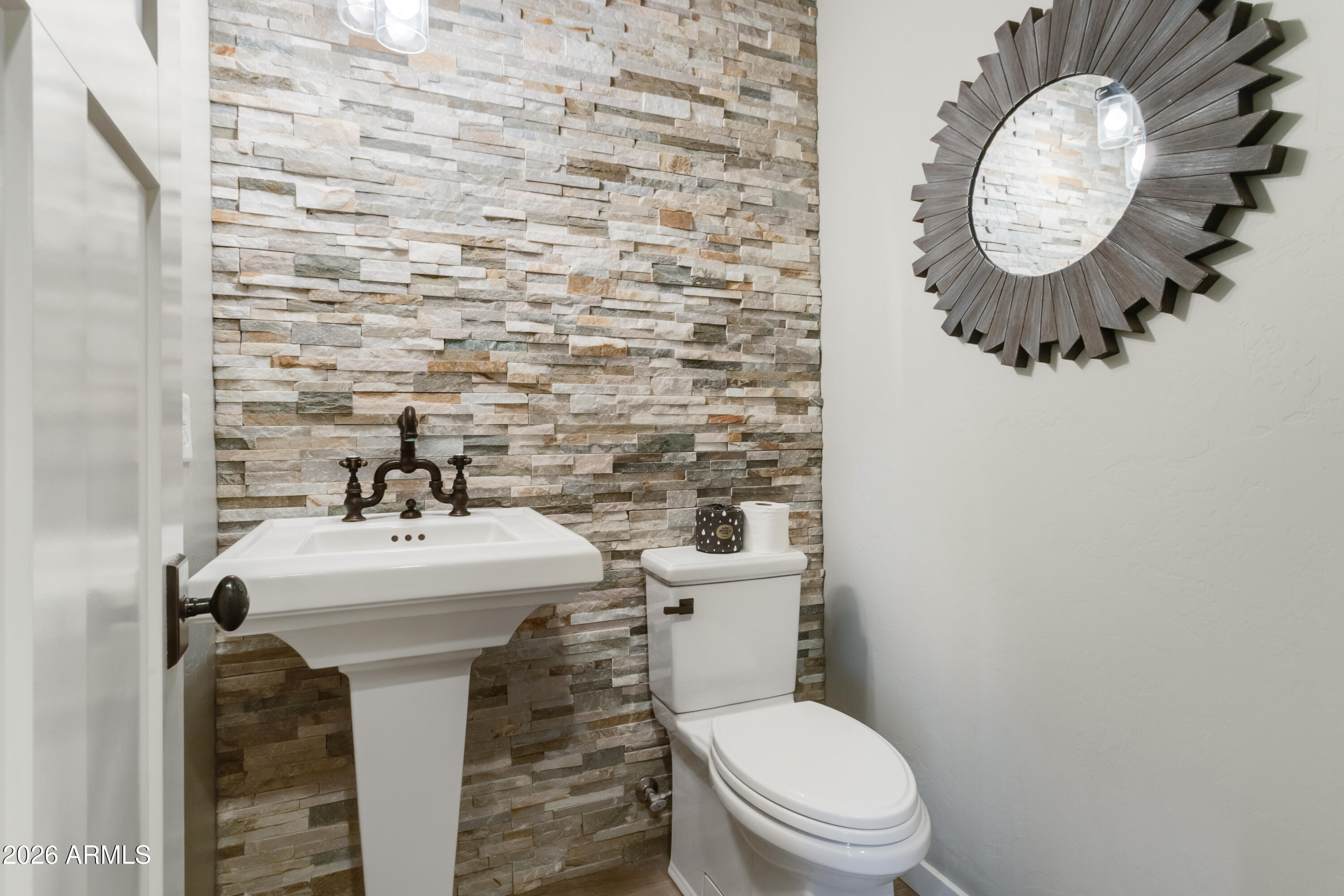 5306 East Spring Road Hereford, AZ 85615 - Photo 35 of 61 a bathroom with a sink and a mirror