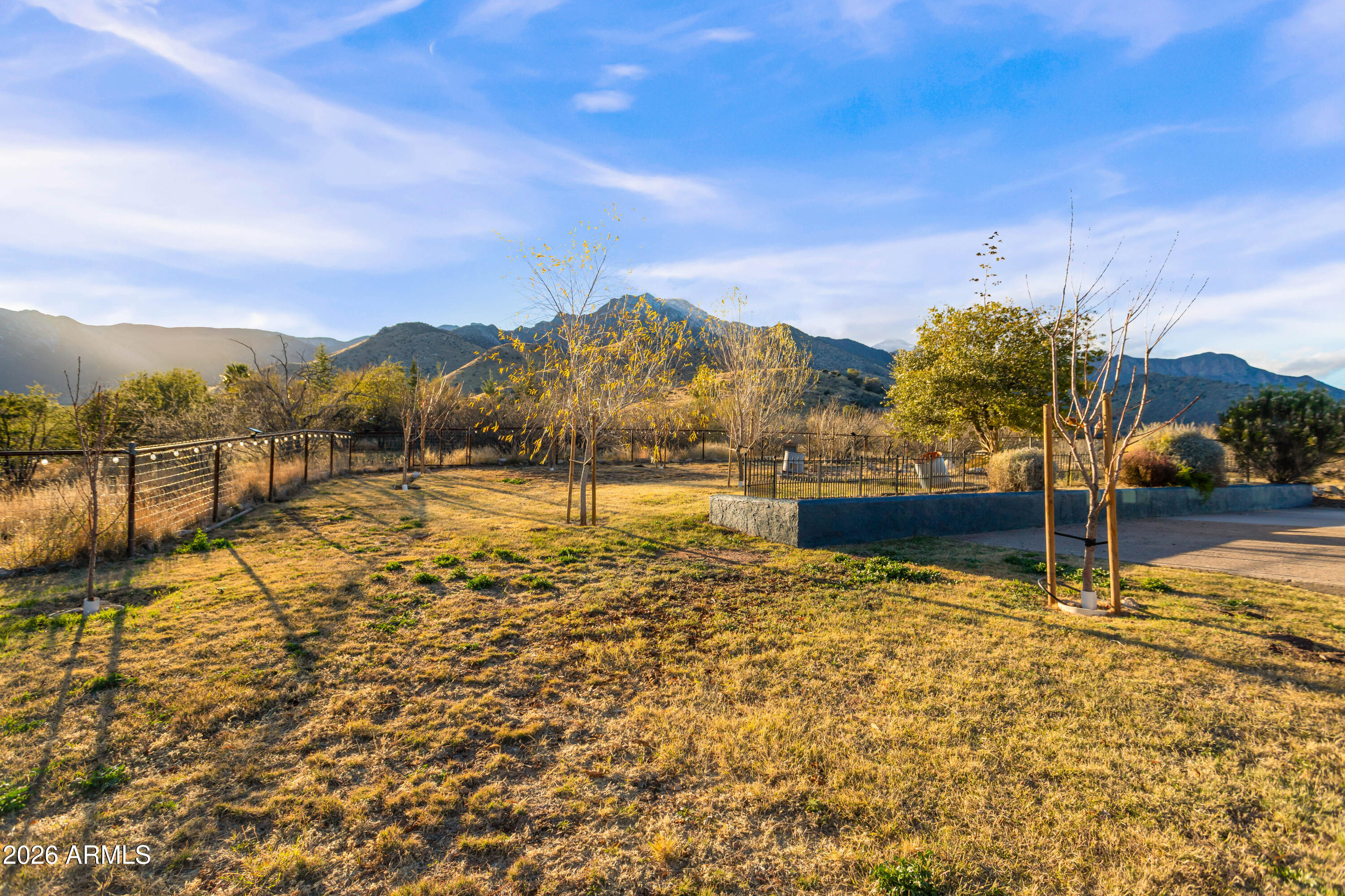 5306 East Spring Road Hereford, AZ 85615 - Photo 36 of 61 a view of a lake with sunset