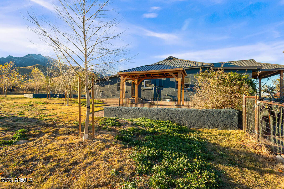 5306 East Spring Road Hereford, AZ 85615 - Photo 44 of 61 a front view of a house with a yard