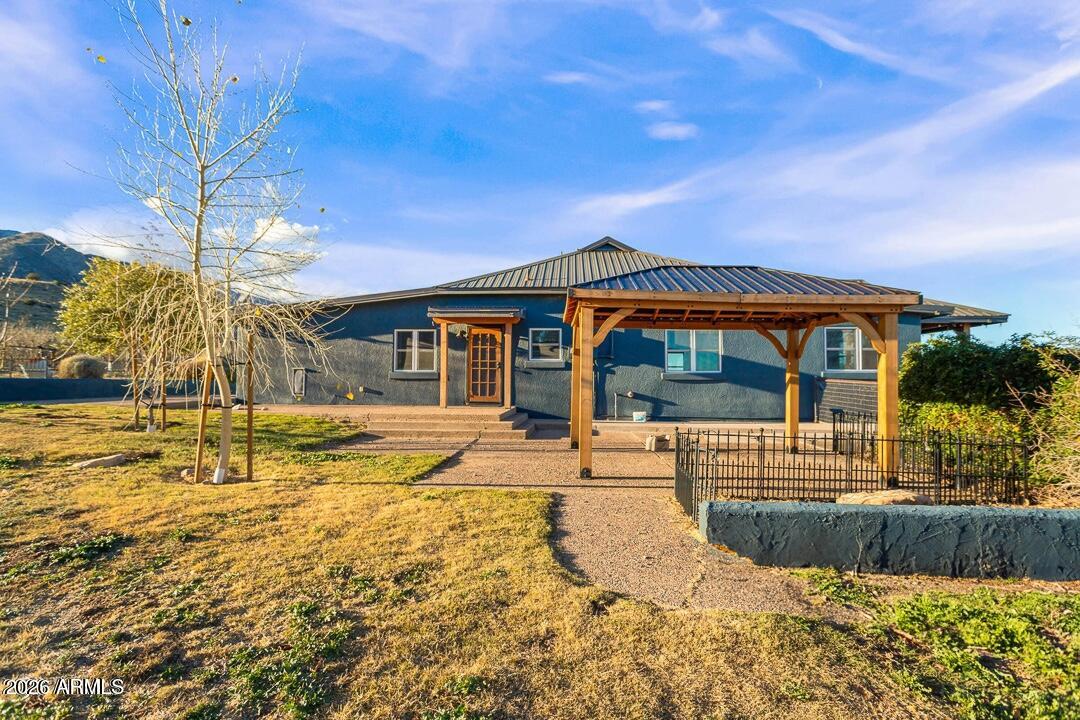 5306 East Spring Road Hereford, AZ 85615 - Photo 45 of 61 a front view of a house with swimming pool