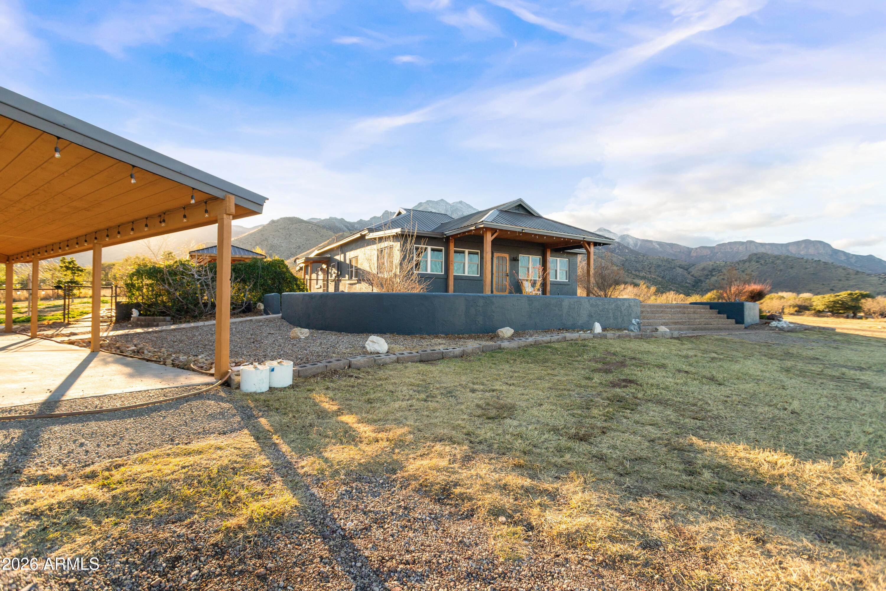 5306 East Spring Road Hereford, AZ 85615 - Photo 49 of 61 a view of a house with a yard