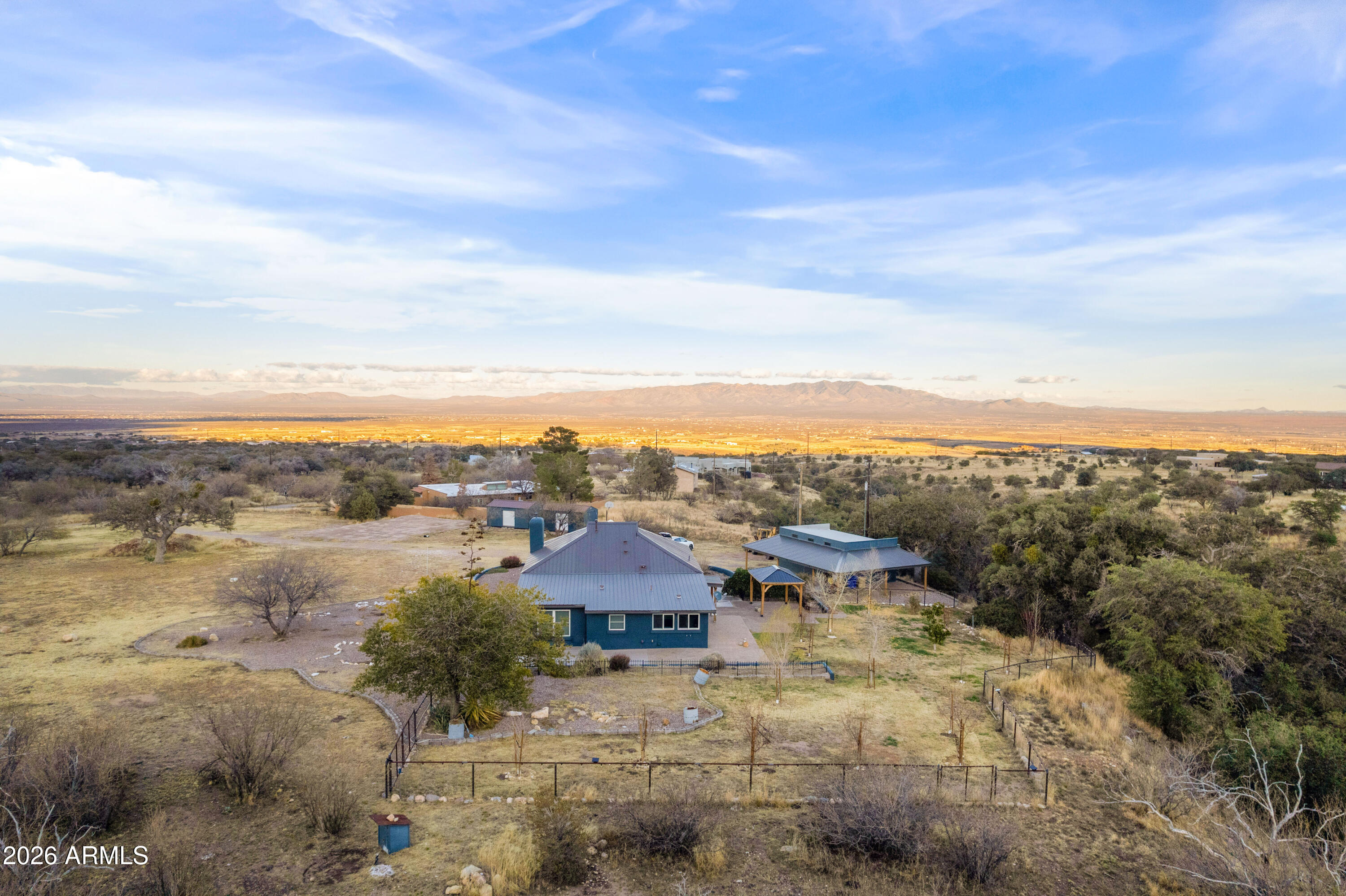 5306 East Spring Road Hereford, AZ 85615 - Photo 56 of 61 a view of a city with mountains in the background