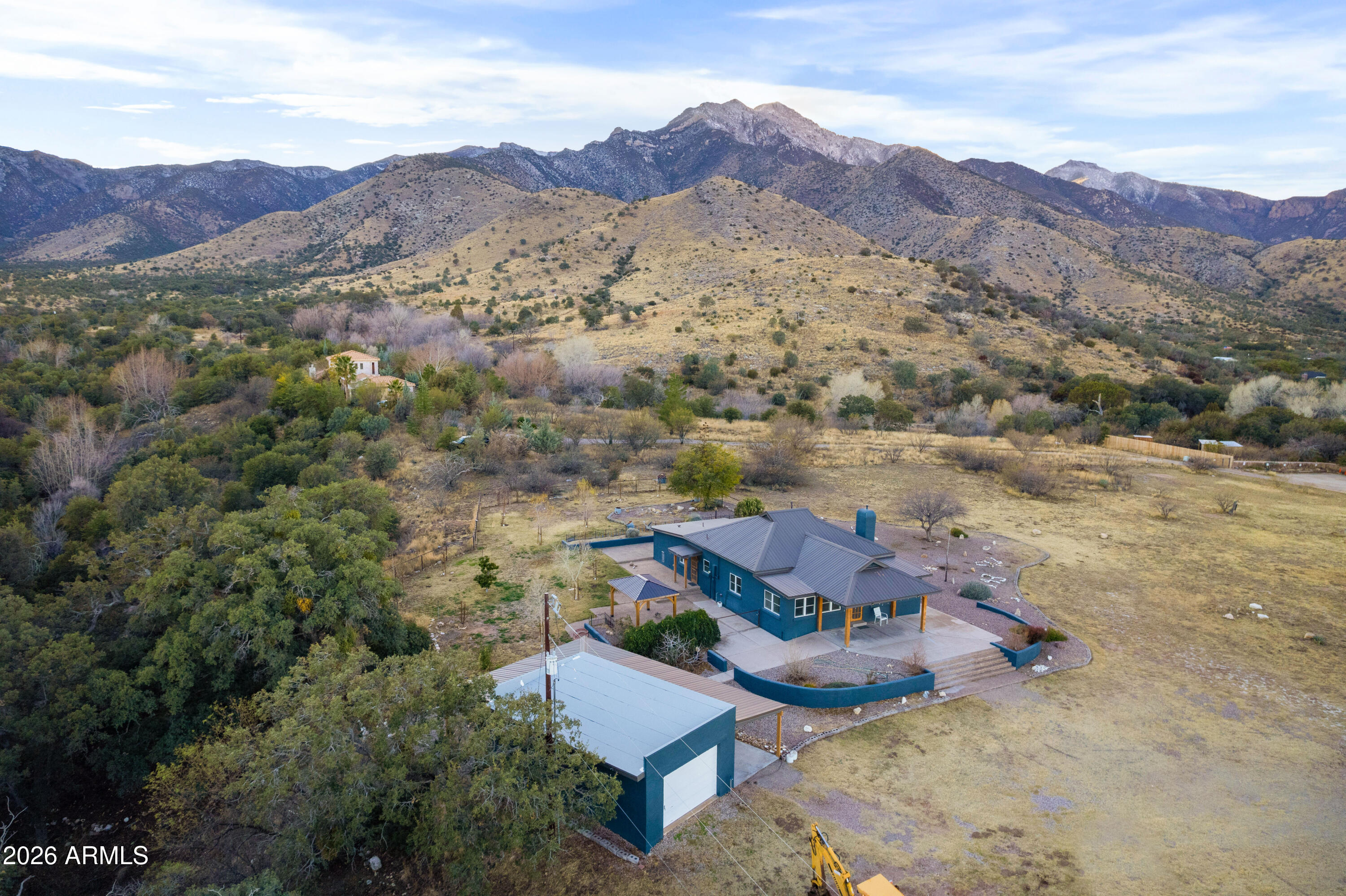 5306 East Spring Road Hereford, AZ 85615 - Photo 59 of 61 an aerial view of a house with mountain view