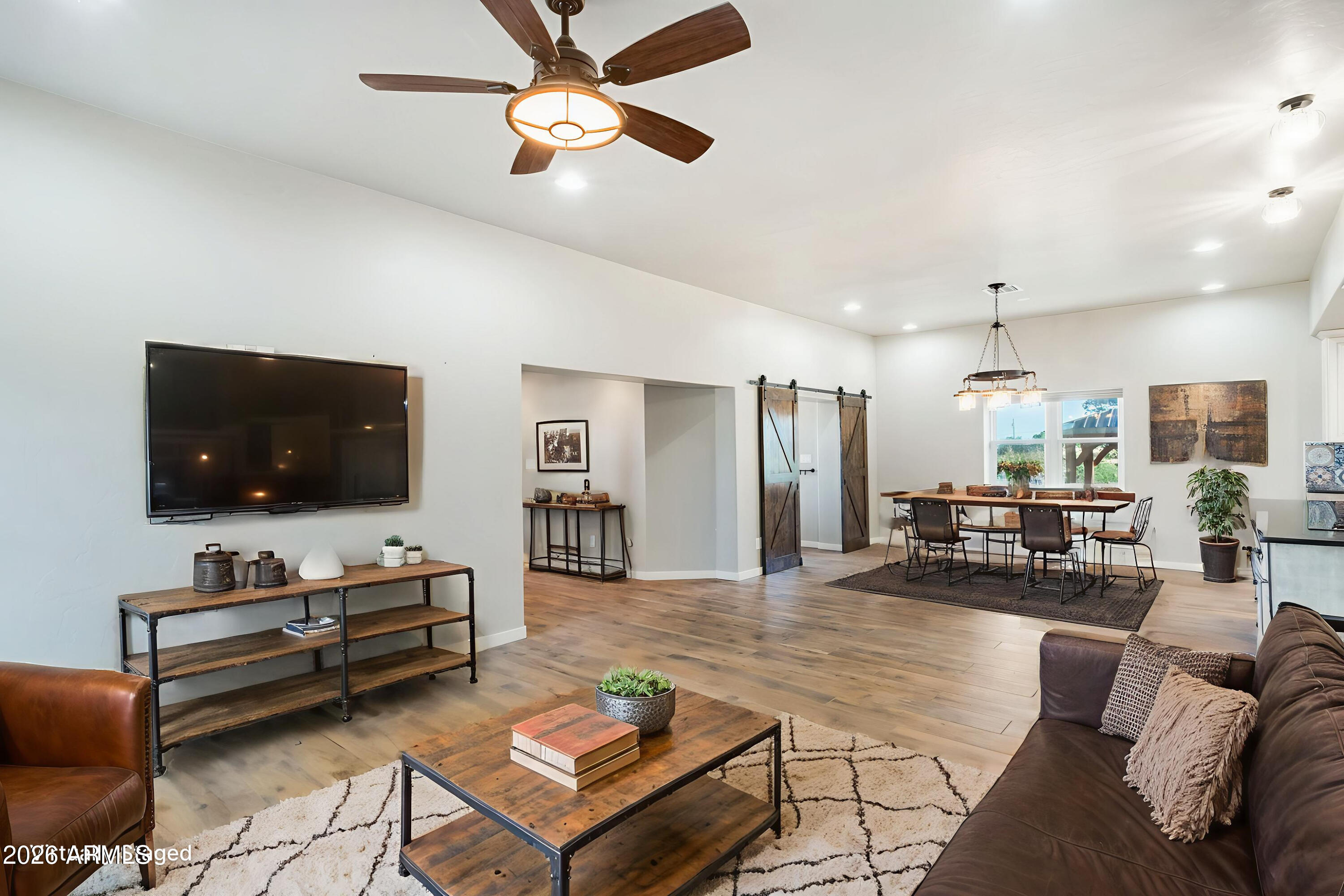 5306 East Spring Road Hereford, AZ 85615 - Photo 10 of 61 a living room with furniture and a flat screen tv