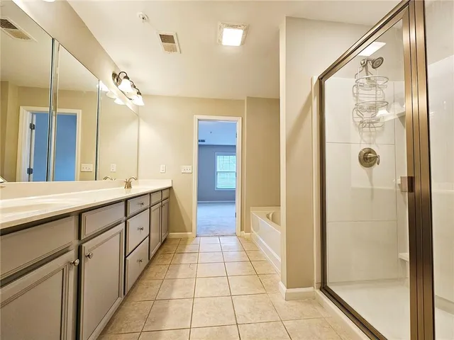 a bathroom with a double vanity sink and a mirror