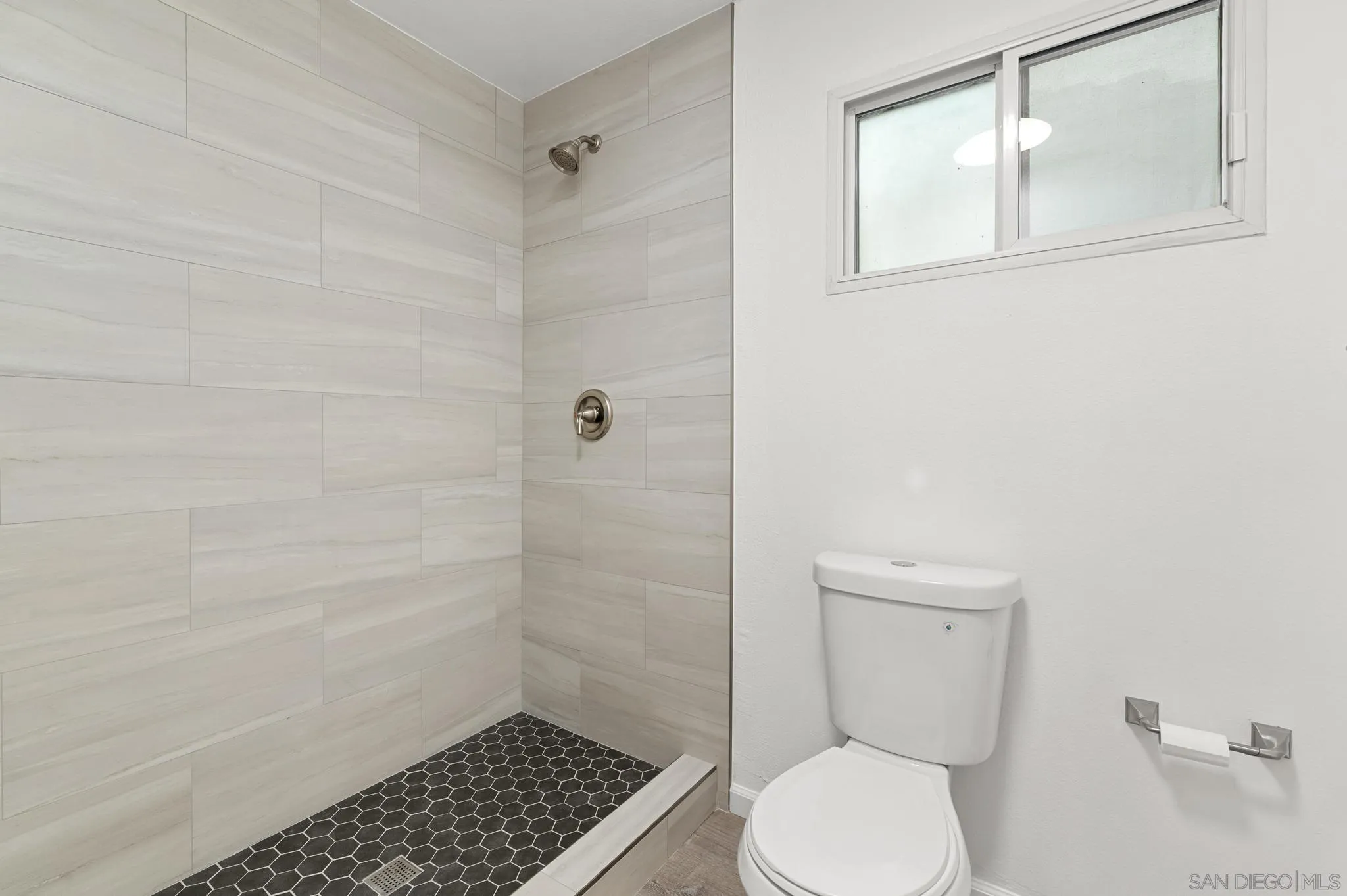 140 Walnut Avenue, Unit 2A San Diego, CA 92103 - Photo 11 of 22 a bathroom with a toilet and a shower